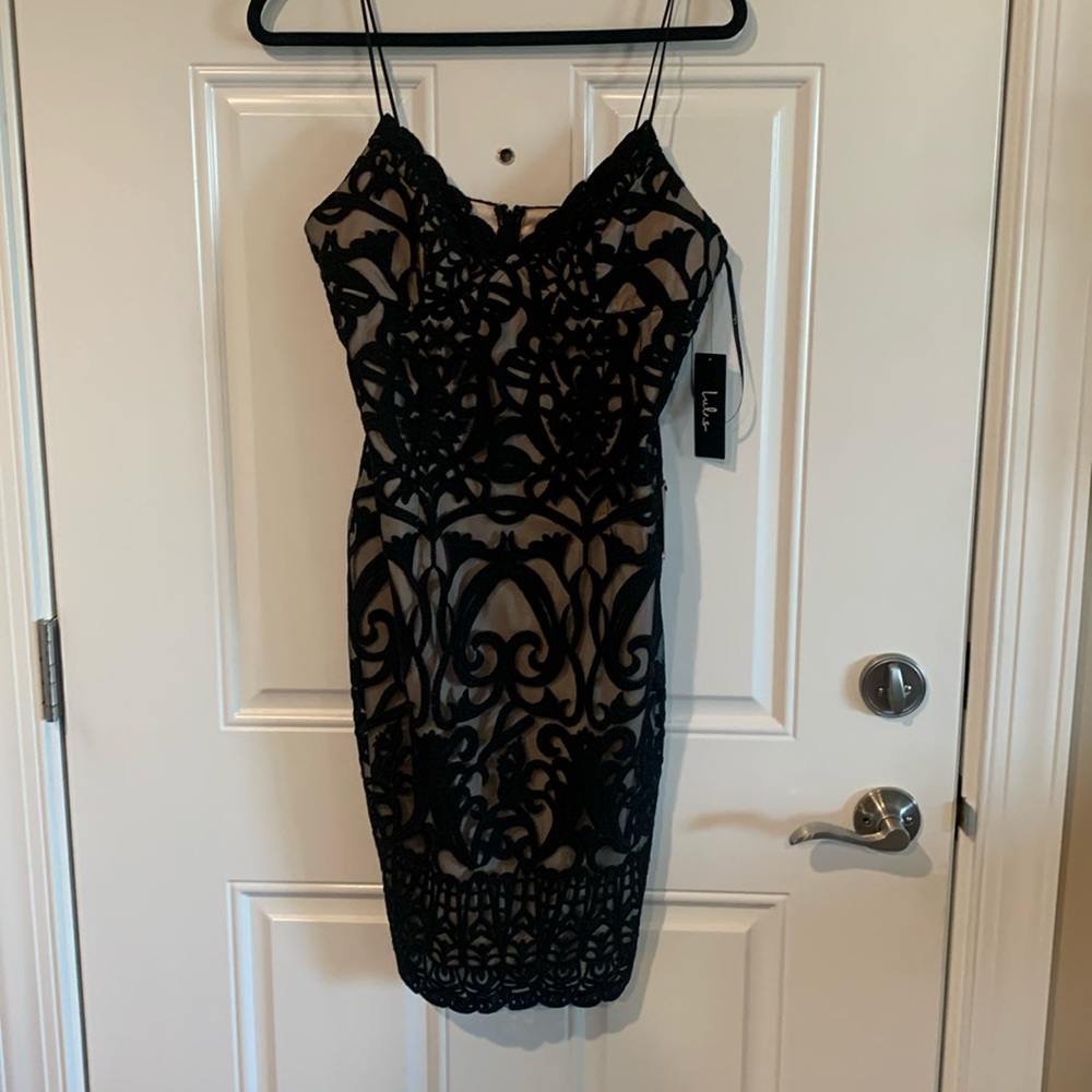 Beautiful nude underlay with black lace. Tea length dress